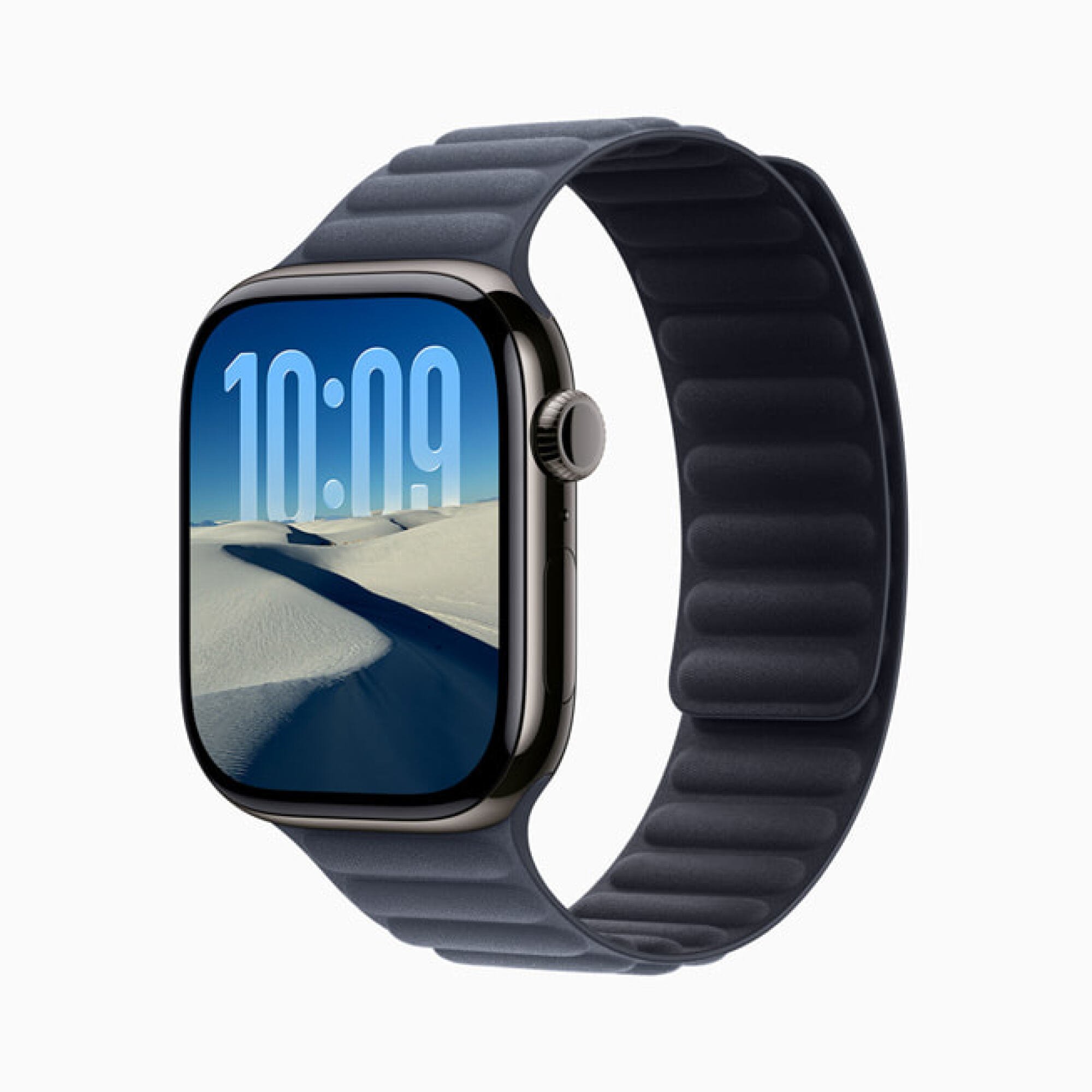 Sebuah Apple Watch menampilkan adegan gurun dan langit biru, dengan waktu saat ini dimasukkan ke dalam lanskap.